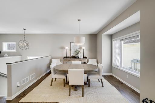 The formal dining space opens up to the rest of the home. It is spacious for all those warm gatherings.