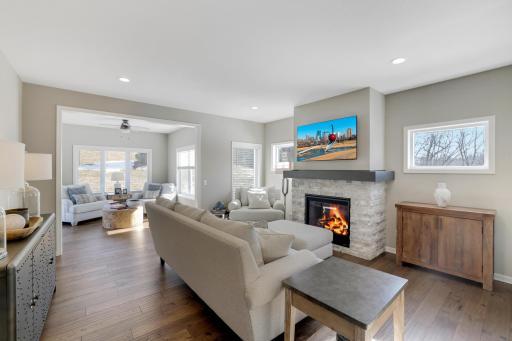 The main floor is designed around an open, bright layout where the white woodwork keep everything feeling light and current.