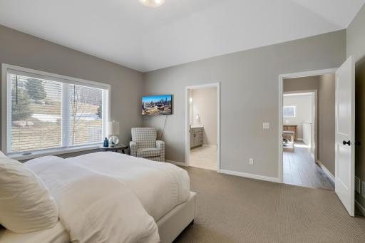 A secondary view of this primary space with a view of the long hallway entrance that creates privacy from the rest of the home.