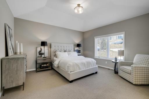 Welcome to your primary bedroom, a retreat for the long days where you can unwind and relax from the rest of the world.