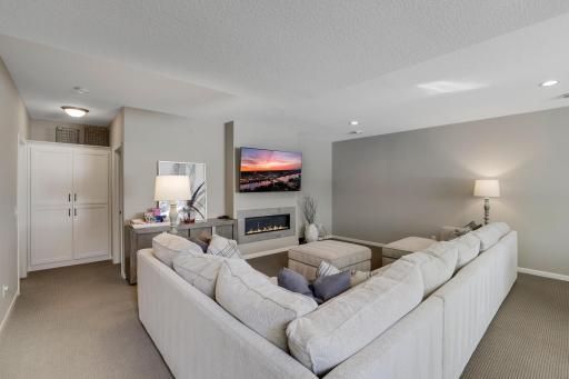 The gas burning fireplace is the focal point of this room with a sleek and modern design.