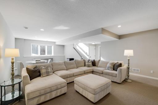 The lower level features a large recreation room that’s perfect for a second living area or hobby space, along with two more bedrooms and a full bathroom.