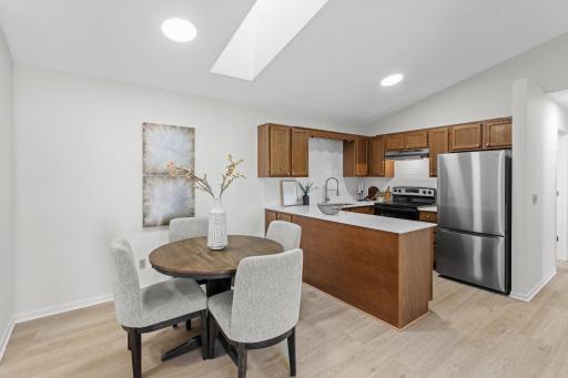 Walk into this fresh, renovated, unit with new kitchen appliances, counters, sink, hardware, and backsplash! Skylight overhead lets in the natural light and vaulted ceilings open up the space.