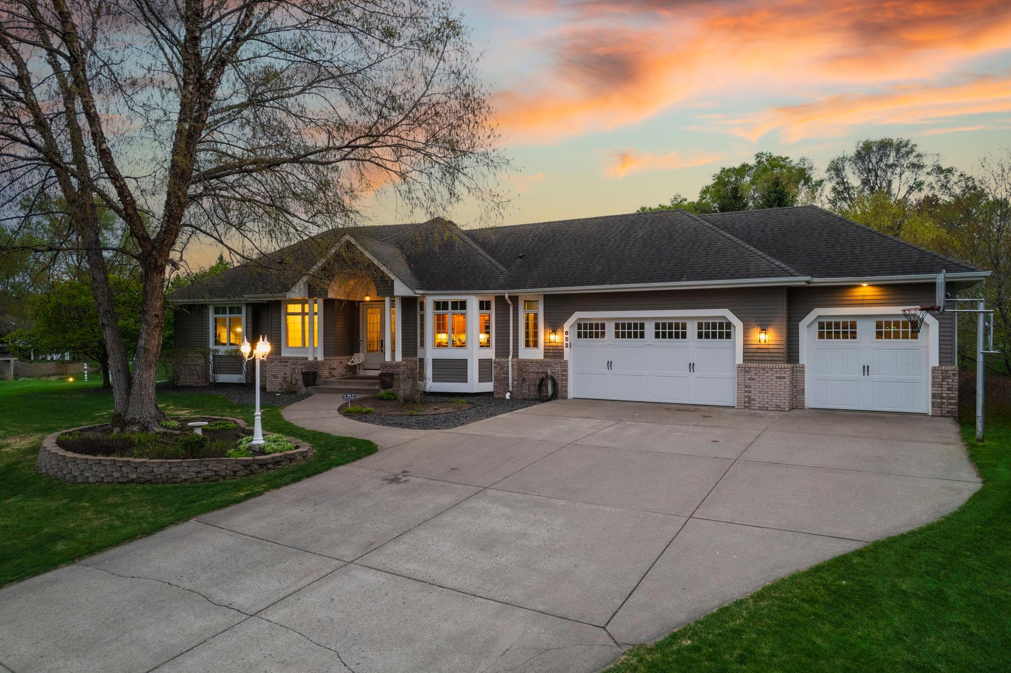 The 2.5 car garage provides ample storage and includes a rear overhead door, ideal for golf cart access.