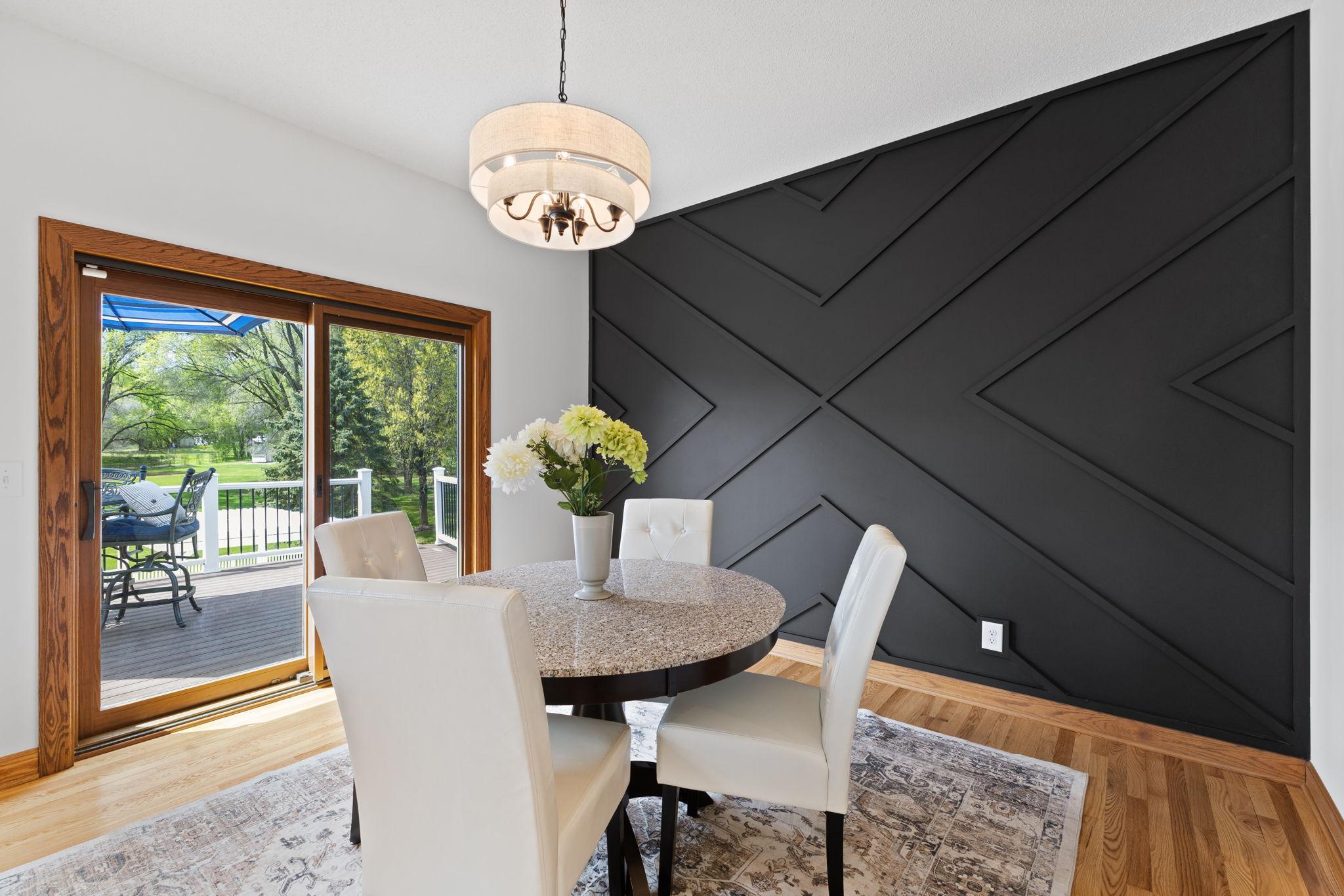 This formal dining room easily accommodates larger gatherings and entertaining with convenient access to the deck and pool!