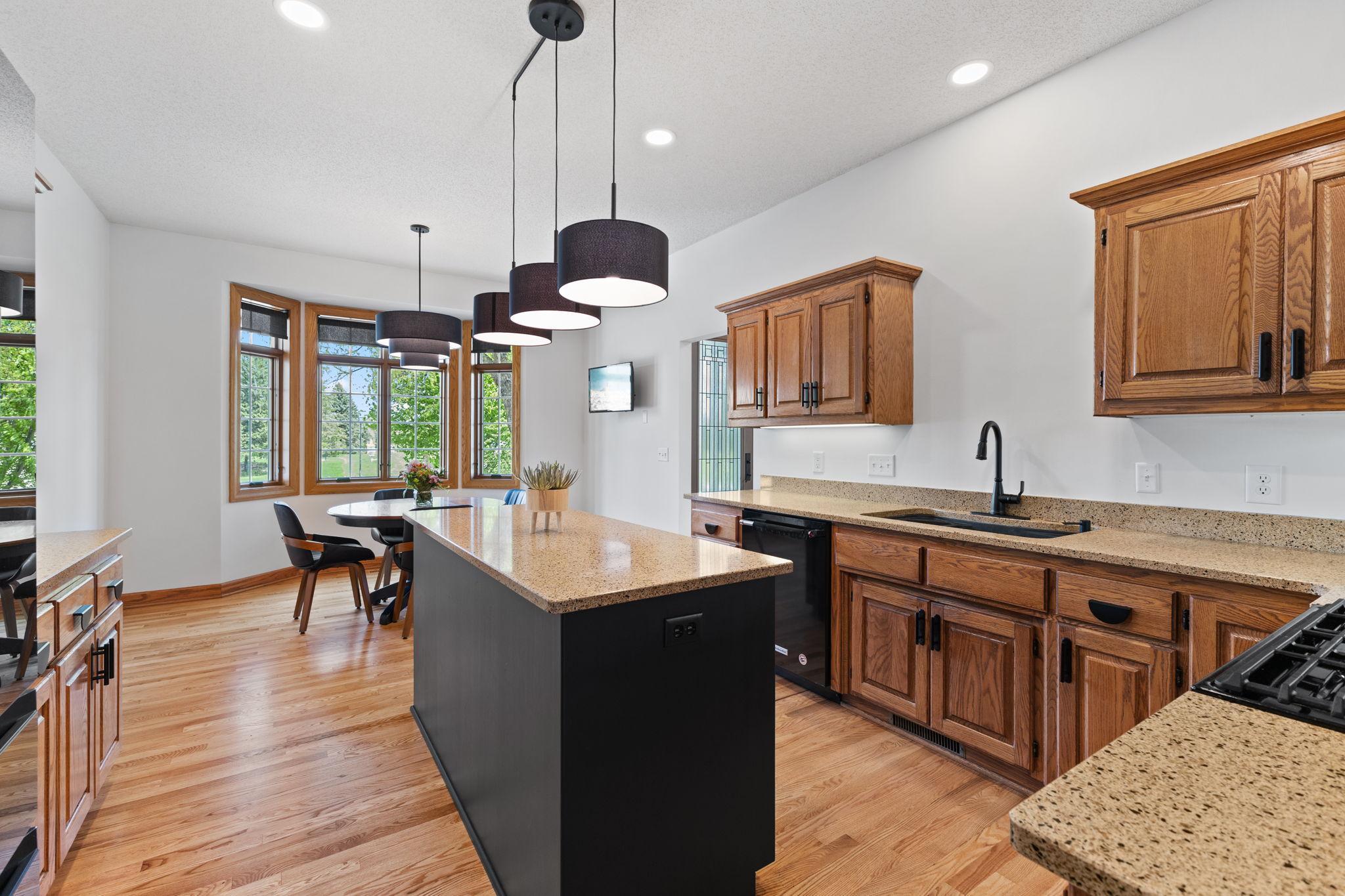The center island provides additional prep and storage space, along with convenient built-in outlets to easily power all your kitchen tools.