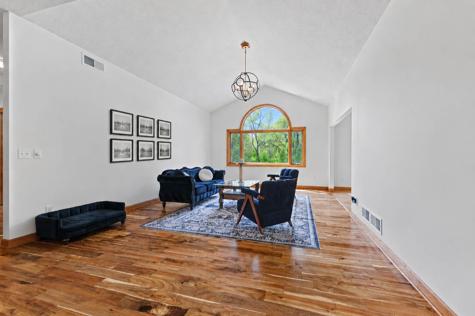 Gleaming hard surface floors flow throughout the main level for a seamless look.