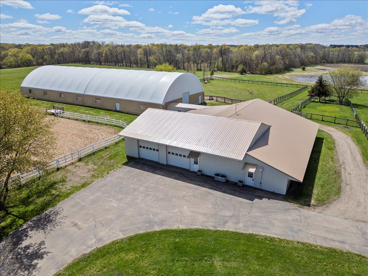 Heated workshop 14x80, cold storage 40x60 with concrete floor, and a heated 6 stall horse barn.