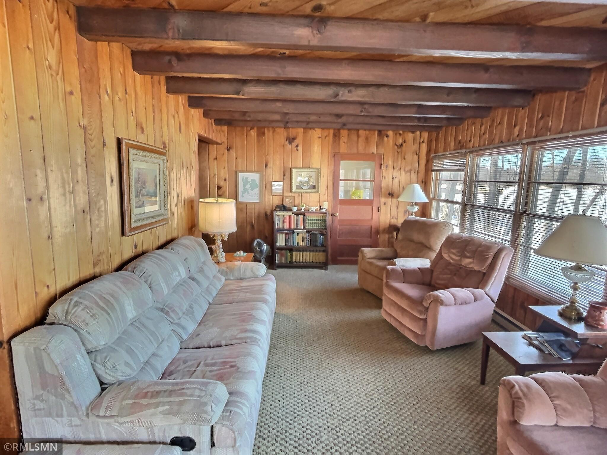 As the Main floor provides the main entrance and the 4 bedrooms the lower level walkout provides all the living amenities. The entire width of the home gives great views to the lake through the wall of windows.