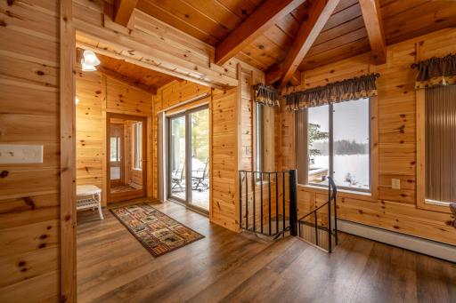 Door leading to deck and spiral staircase leading to lower level.