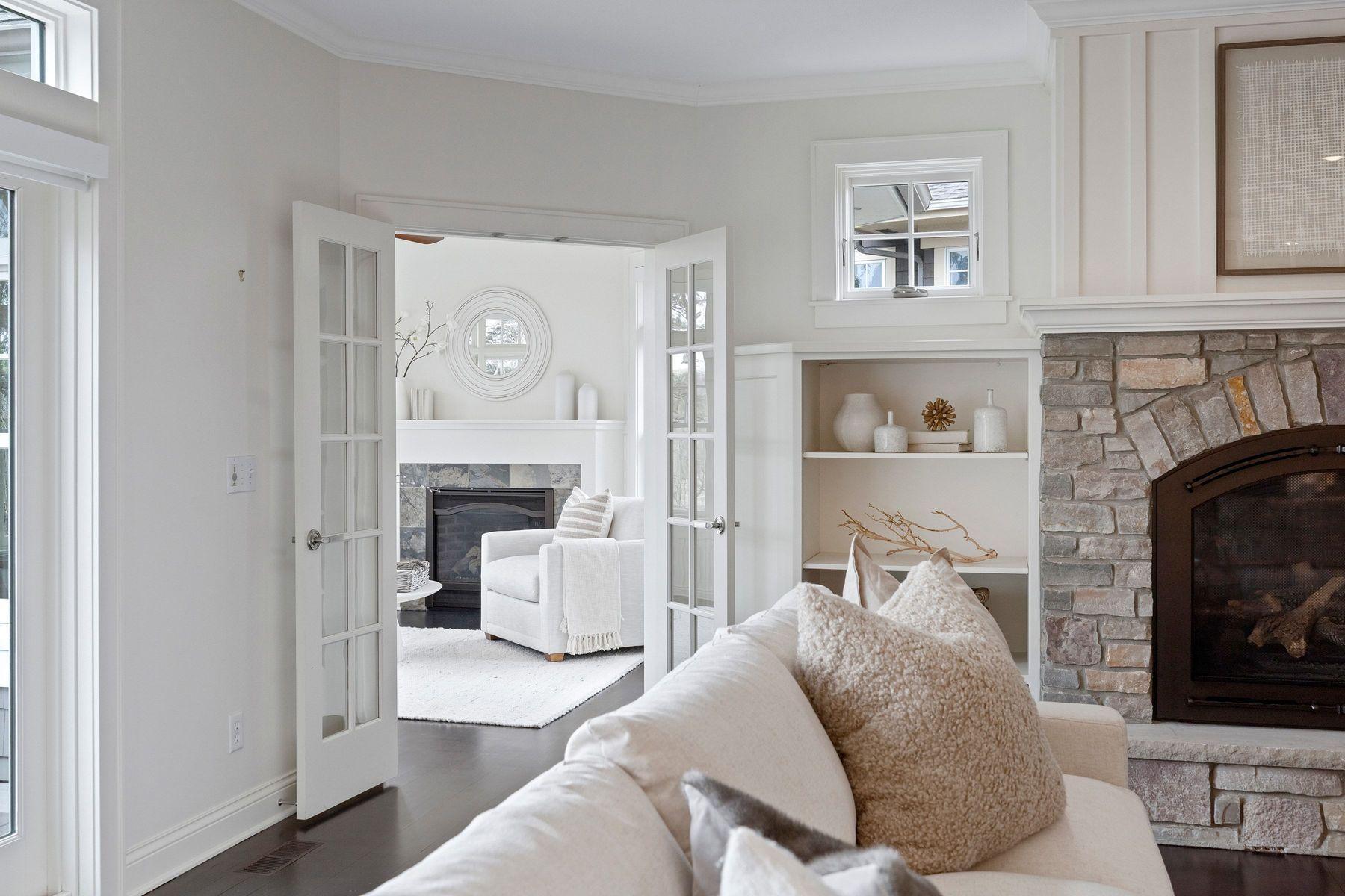 Entry to sunroom with fireplace, spectacular lot and lake views