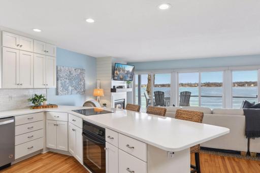 The bright kitchen offers endless water views.