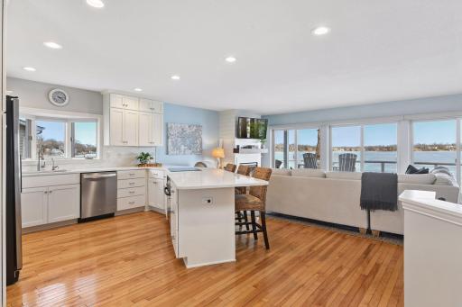 Enjoy an open and inviting kitchen with a wraparound countertop perfect for bar seating, overlooking the living room and flowing naturally to the dining room and outdoor entertaining space.
