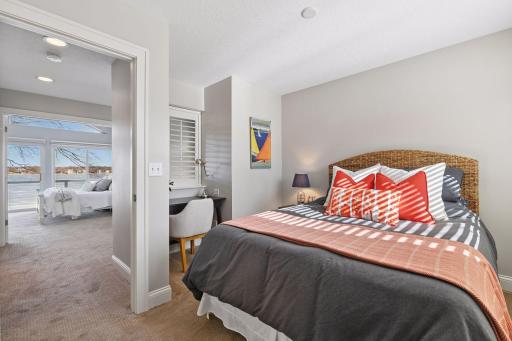 1 of 3 upper level bedrooms with a convenient office alcove.