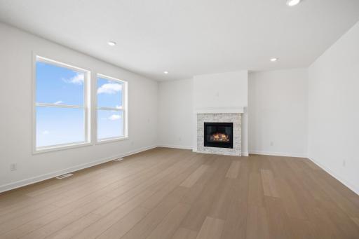 The Great Room features large windows for ample natural light and is the perfect place for gathering with friends and family.