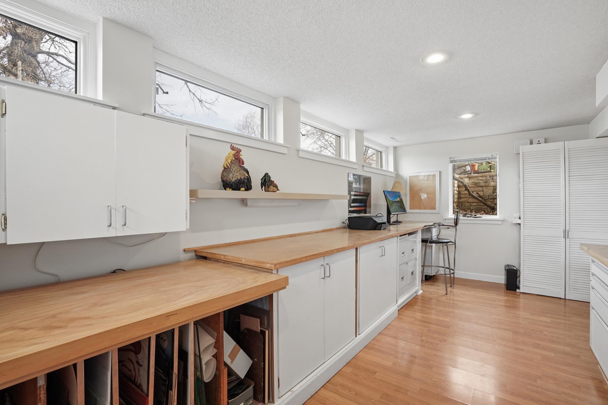 Basement addition work space or bedroom with egress window