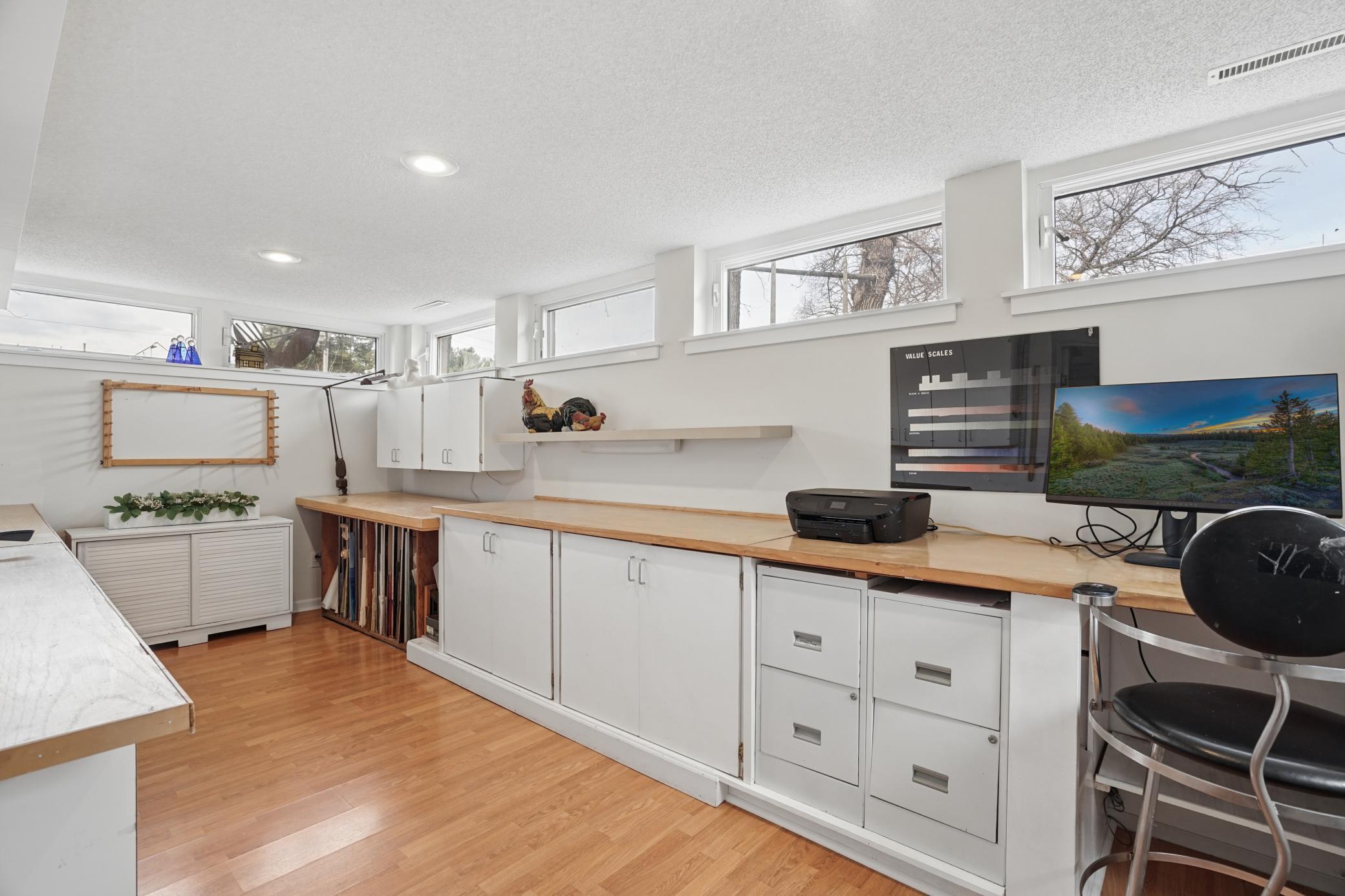 Basement addition work space or bedroom with egress window