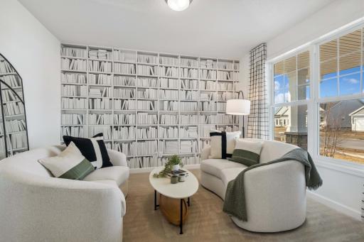 (Photo of decorated model, actual home's finishes will vary) Main level flex room.