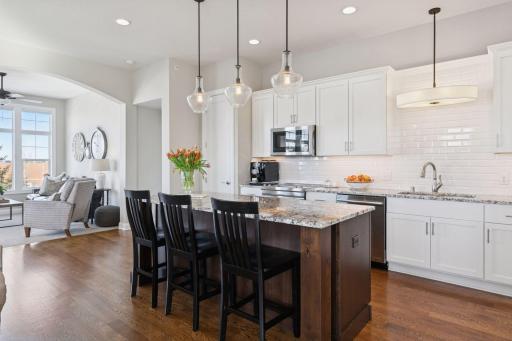 Kitchen flows right into the sun room, great for entertaining and relaxing.