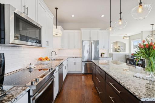Great stainless steel appliances and a view of the extra cabinet space in your center kitchen island.
