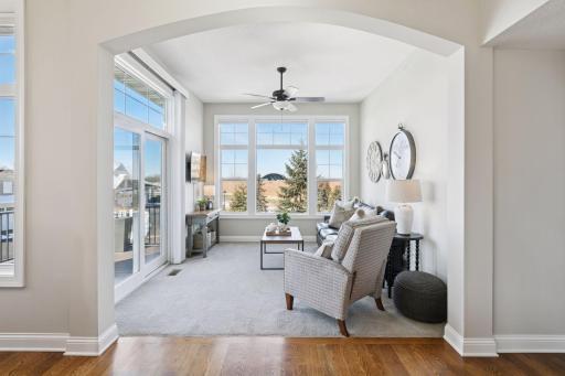 Sun room in the house that is perfect for hanging out and relaxing. It features the sliding glass door to step out on your deck!