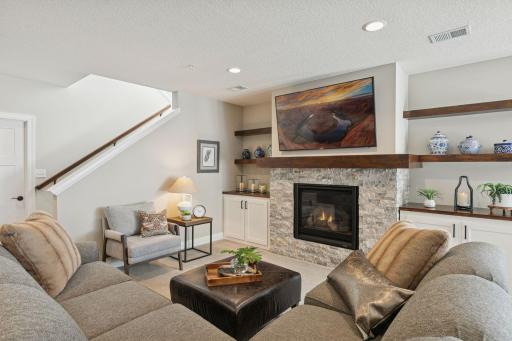 Multiple seating options for the basement, this angle shows a lovely view of your basement TV while sitting and relaxing on the couch.