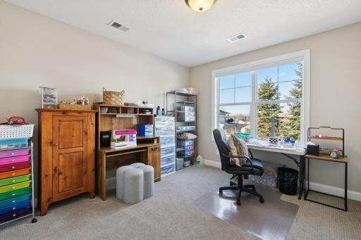 Bedroom on the lower level that is very spacious. As seen here this was used as a crafts room! Multiple ways to use your space.