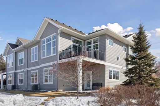Back view of the twin home! Here you see the deck off the main level and walk-out on the lower level.