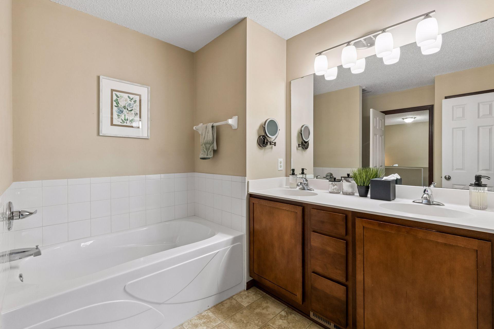 Walk-through full bathroom connected to primary bedroom. Double sinks for added convenience.