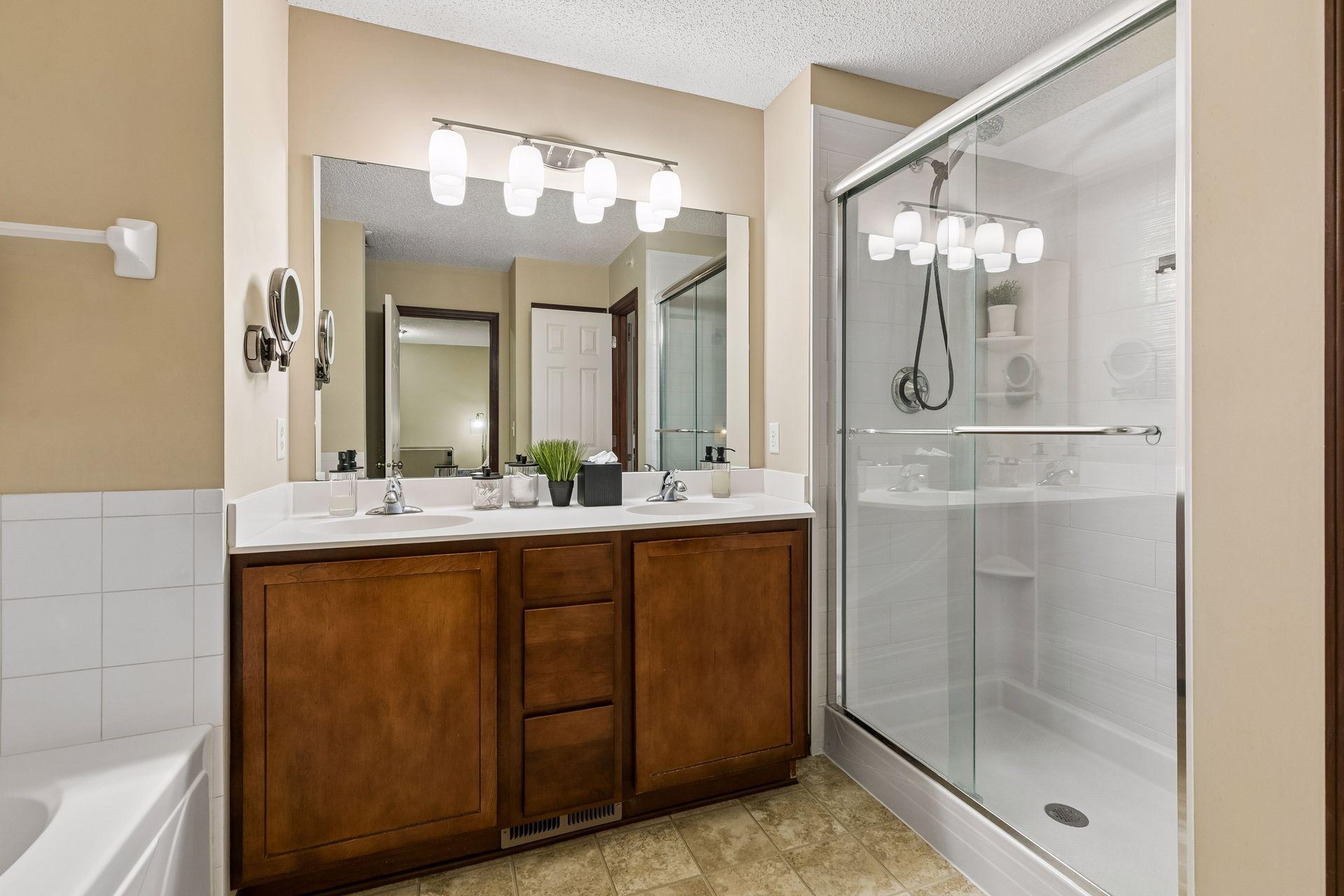 Bathroom featuring a separate shower and tub. Shower new 2021.