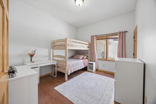 The main floor bedroom! Could serve as a bedroom or main floor office area. This room along with the entire main level offer high ceilings which opens up the room.