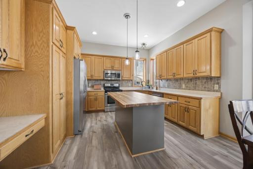 The kitchen features a butcher block countertop and plenty of space for prepping meals!