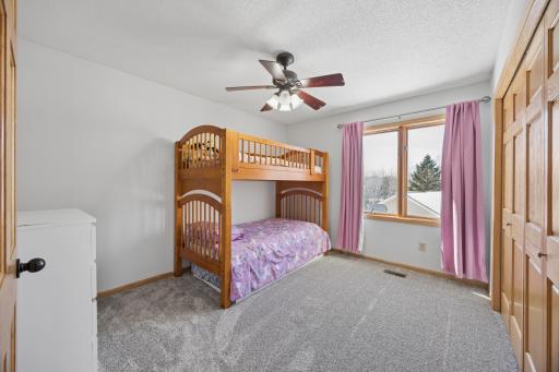 One of five total bedrooms. This one is on the upper level. This room overlooks the side of the home. New carpet and fresh paint!
