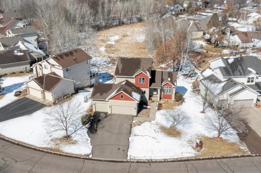 Aerial photo during winter of the front of the home! Note the nature setting behind the home! Check out the virtual 3D tour for more details on this home!