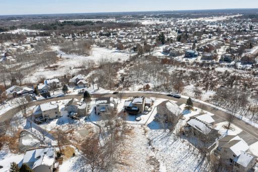 Aerial photo during winter from the back of the home. Note the open space near the home!