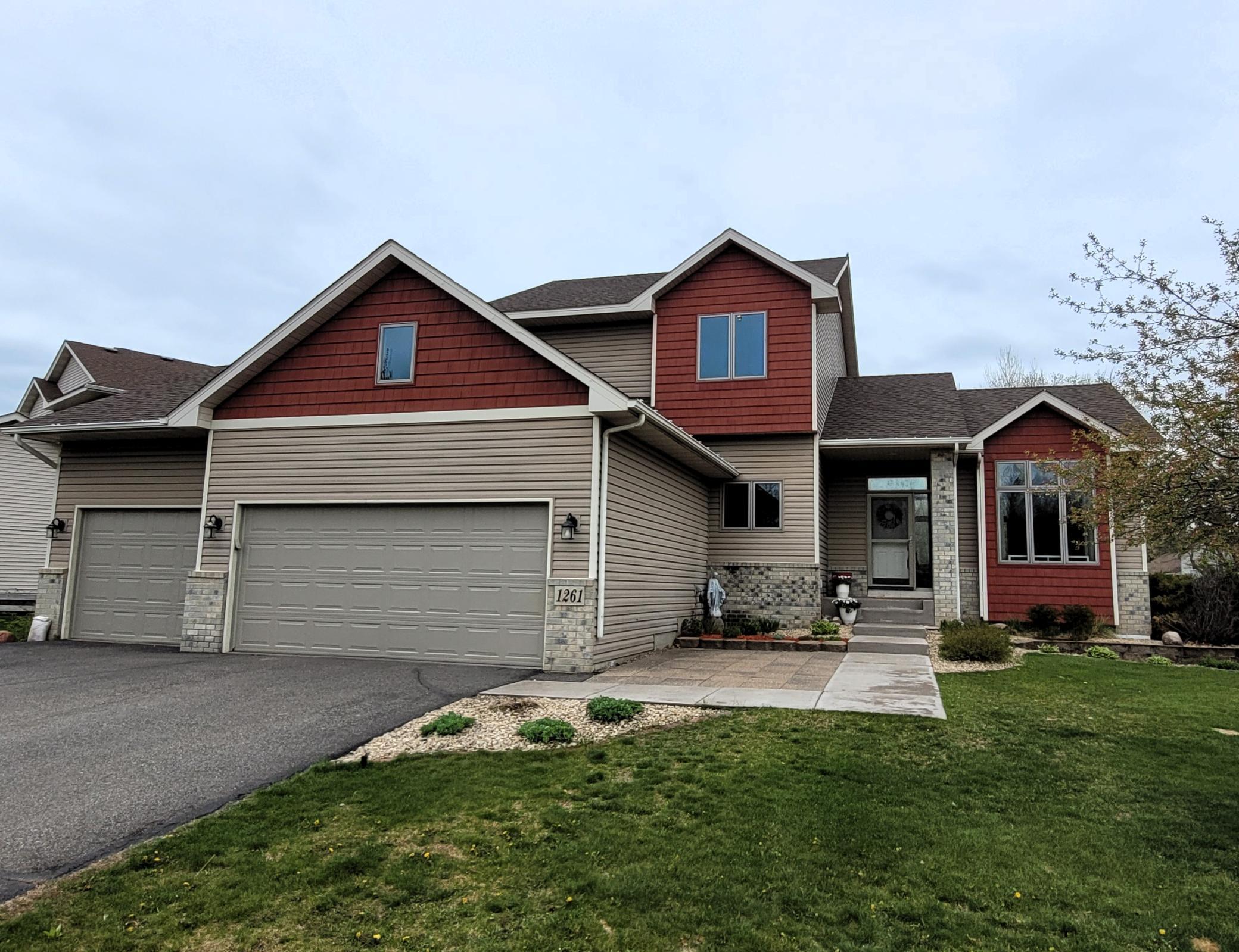 Welcome home to 1261 156th Ln NW in Andover! Check out the virtual tour for a 3D walk through of the home! This home has great curb appeal with siding that contrasts perfectly with modern colors.