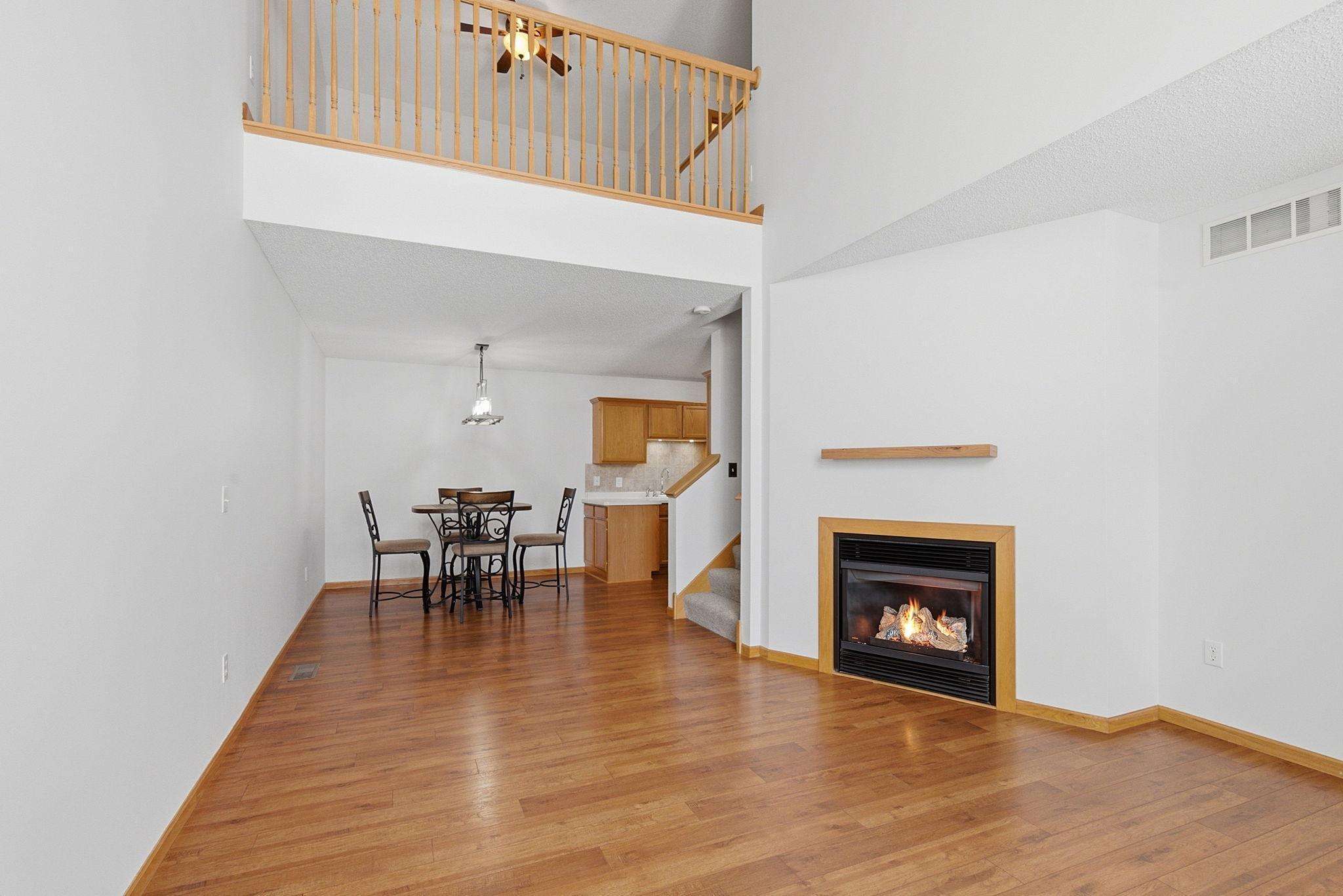 Great room with view to dining room and loft above.