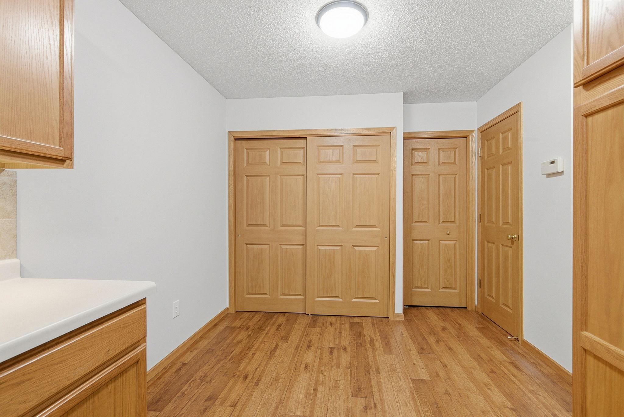 Additional dining space, utility closet, pantry closet, and 1/2 bath