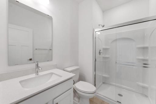 (Photo of an inventory home, actual homes finishes will vary) Main level bath.