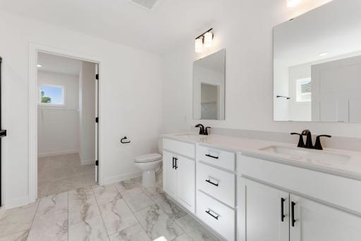 (Photo of an inventory home, actual homes finishes will vary) Both the tub and separate shower are included in the primary bath.
