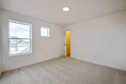 (Photo of an inventory home, actual homes finishes will vary) One of three spacious secondary bedrooms.