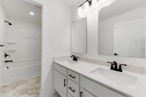 (Photo of an inventory home, actual homes finishes will vary) Full guest/hall bath.