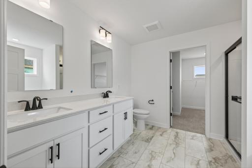 (Photo of a similar home, features will vary) The owner's bath also features a double vanity!