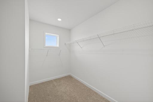 (Photo of a similar home, features will vary) The owner's suite features an incredible walk-in closet.