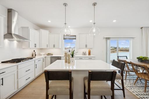 (Photo of a similar home, features will vary) Enjoy island seating for quick snacks or informal dining for a crowd.