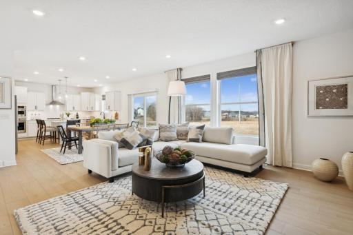 (Photo of a similar home, features will vary) The Great Room features large windows for ample natural light and is the perfect place for gathering with friends and family.