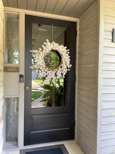 Original brass mail slot, covered entry area
