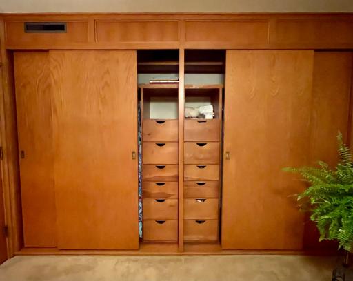 Built-in dressers and shoe racks inside most bedroom closets