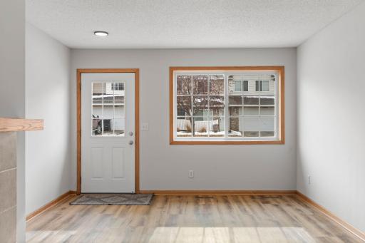 Entry Space with 1/2 Panel Window, New LED Lighting and LVP Flooring provides the initial welcome!
