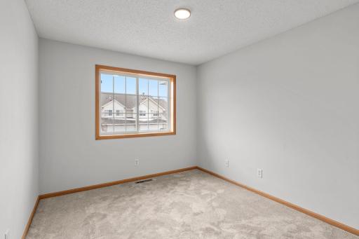 Second Bedroom includes New Carpeting, New Lighting with Night Light Feature and Large Window.